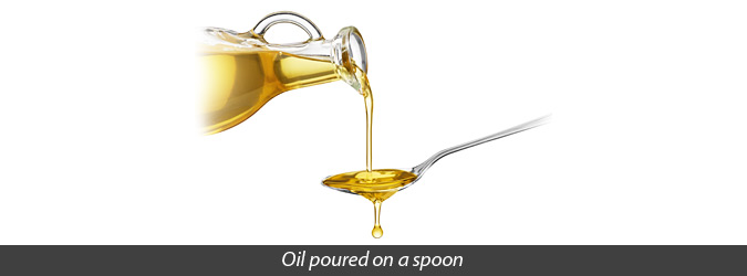 oil poured on a spoon